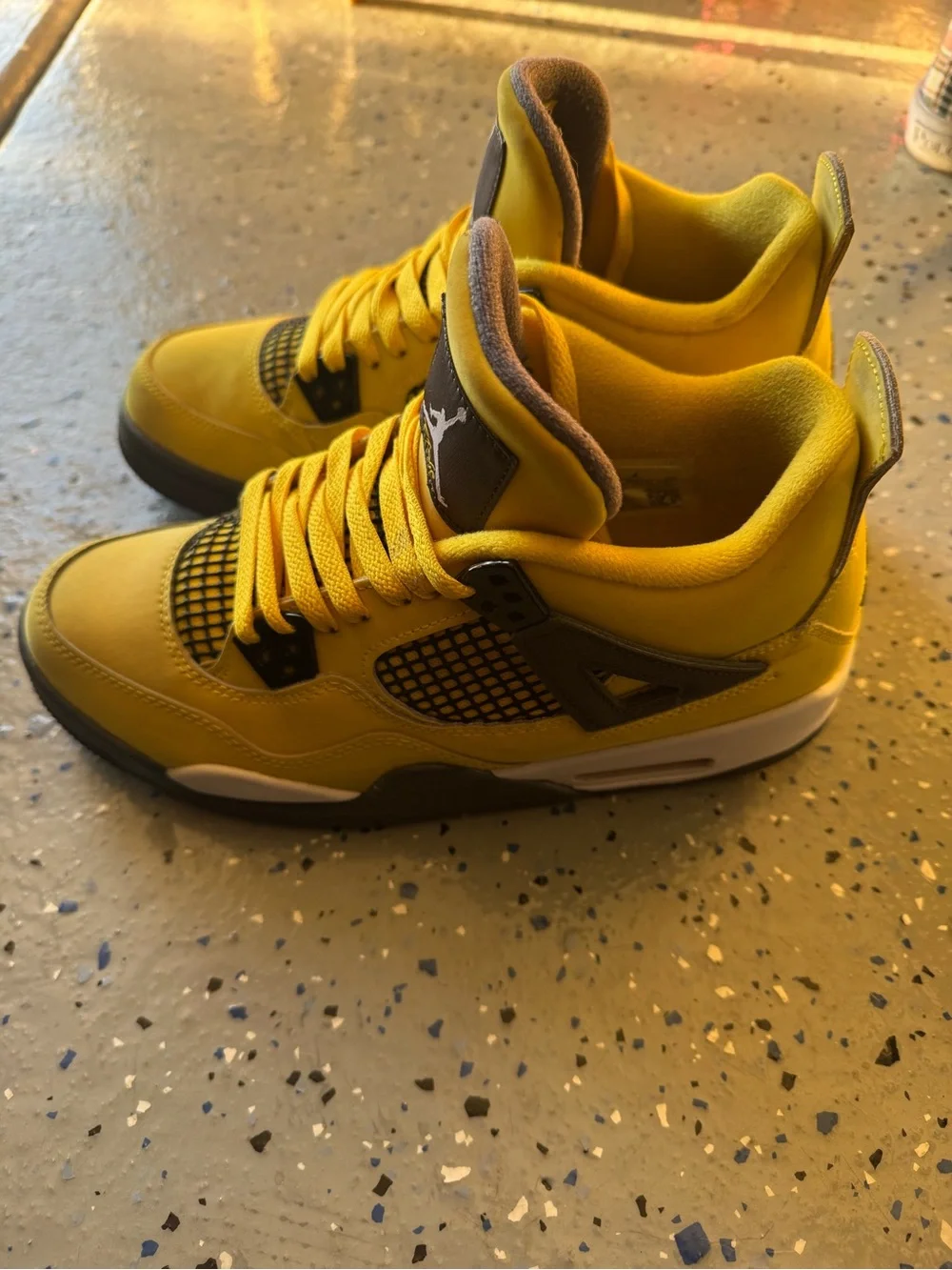 Jordan Yellow and Black Retro 4 Sneakers “Yellow Lightning”